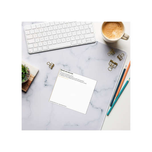Black Cat Season notepad on desk with coffee and props