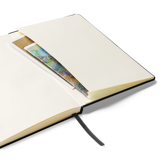 The Writing Myself a Fan Letter journal open to its cream lined pages, showing the ribbon marker and the expandable inner pocket
