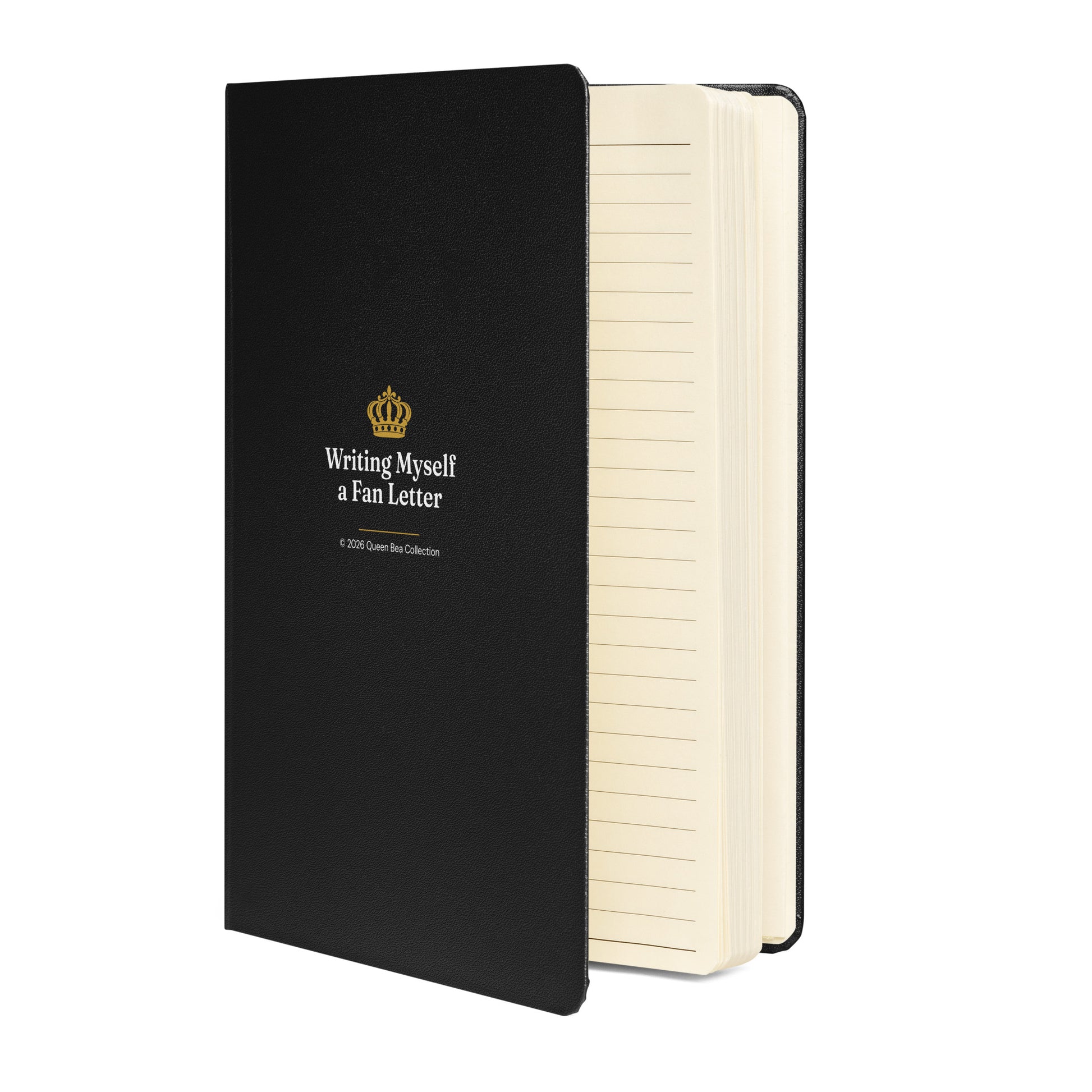 Writing Myself a Fan Letter journal in black standing upright, showing the gold crown cover and cream page edges