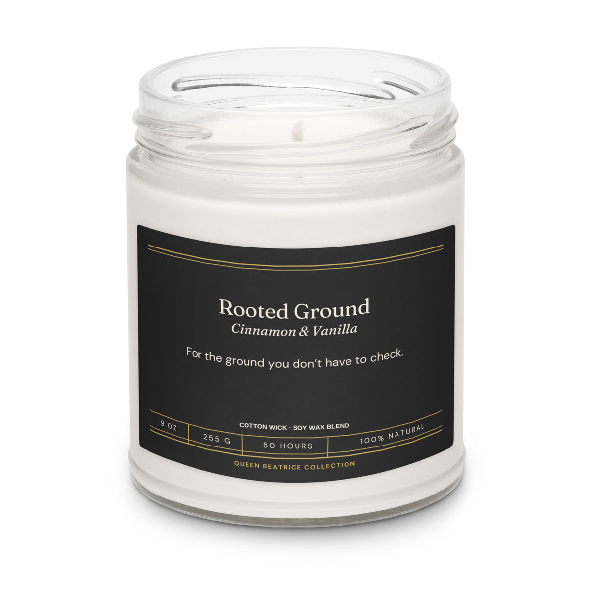 Rooted Ground soy candle in a glass jar with the black Ember & Intention label, Cinnamon & Vanilla
